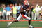 CHAMPAIGN, IL - OCTOBER 06:  Quarterback Eddie McGee #10 of the Illinois Fighting Illini runs out of the pocket against the Wisconsin Badgers October 6, 2007 at Memorial Stadium in Champaign, Illinois.  (Photo by Matthew Stockman/Getty Images)