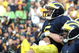ANN ARBOR, MI - SEPTEMBER 12:  Quarterback Tate Forcier #5 of Michigan is hugged by a teammate after scoring a touchdown late in the game against Notre Dame at Michigan Stadium on September 12, 2009 in Ann Arbor, Michigan.  (Photo by Domenic Centofanti/Getty Images)