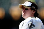 OAKLAND, CA - AUGUST 29:  Quarterback Drew Brees #9 of the New Orleans Saints looks on from the sideline during the preseason game against the Oakland Raiders at Oakland-Alameda County Coliseum on August 29, 2009 in Oakland, California. (Photo by Jed Jacobsohn/Getty Images)