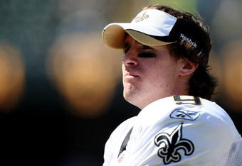 OAKLAND, CA - AUGUST 29:  Quarterback Drew Brees #9 of the New Orleans Saints looks on from the sideline during the preseason game against the Oakland Raiders at Oakland-Alameda County Coliseum on August 29, 2009 in Oakland, California. (Photo by Jed Jacobsohn/Getty Images)