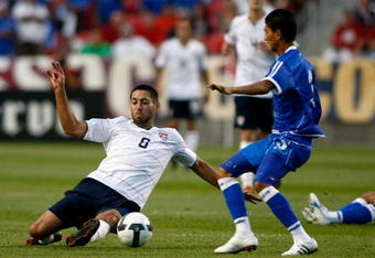 SANDY, UT - SEPTEMBER 05:  Clint Dempsey #8 of the United States slides to get the ball against Marvin Gonzales #3 during the FIFA 2010 World Cup Qualifier match between the United States and El Salvador at Rio Tinto Stadium on September 5, 2009 in Sandy, Utah.  (Photo by Jonathan Ferrey/Getty Images)