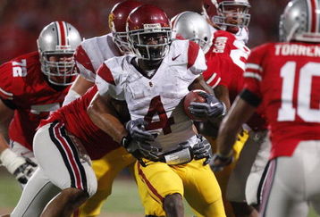 COLUMBUS, OH - SEPTEMBER 13:  Joe McKnight #4 of the Southern California Trojans looks for running room while playing the Ohio State Buckeyes on September 13, 2009 at Ohio Stadium in Columbus, Ohio. USC won the game 18-15. (Photo by Gregory Shamus/Getty Images)