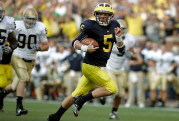 ANN ARBOR, MI - SEPTEMBER 12:  Quarterback Tate Forcier #5 of Michigan runs for a touchdown late in the fourth quarter against Notre Dame at Michigan Stadium on September 12, 2009 in Ann Arbor, Michigan.  (Photo by Domenic Centofanti/Getty Images)
