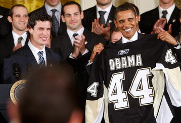 WASHINGTON - SEPTEMBER 10:  U.S. President Barack Obama (R) is presented with a jersey from captain Sidney Crosby (L) of Pittsburgh Penguins during an East Room event September 10, 2009 at the White House in Washington, DC. Obama hosted the Penguins to honor their 2009 Stanley Cup championship victory.  (Photo by Alex Wong/Getty Images)