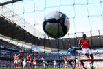 MANCHESTER, ENGLAND - SEPTEMBER 12:  Joleon Lescott (2nd R) of Manchester City watches team-mate Micah Richards' header hit the back of the net during the Barclays Premier League match between Manchester City and Arsenal at the City of Manchester Stadium on September 12, 2009 in Manchester, England.  (Photo by Shaun Botterill/Getty Images)