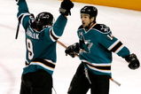 SAN JOSE, CA - MAY 02:  Jonathan Cheechoo #14 of the San Jose Sharks celebrates with teammate Milan Michalek #9 after Michalek scored a third period goal against the Dallas Stars during game five of the Western Conference Semifinals of the 2008 NHL Stanley Cup Playoffs at HP Pavilion on May 2, 2008 in San Jose, California.  (Photo by Christian Petersen/Getty Images)