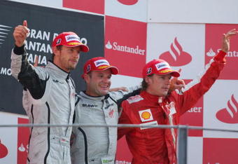 MONZA, ITALY - SEPTEMBER 13:  Race winner Rubens Barrichello (C) of Brazil and Brawn GP celebrates with second placed team mate Jenson Button (L) of Great Britain and Brawn GP and third placed Kimi Raikkonen (R) of Finland and Ferrari on the podium following the Italian Formula One Grand Prix at the Autodromo Nazionale di Monza on September 13, 2009 in Monza, Italy.  (Photo by Mark Thompson/Getty Images)