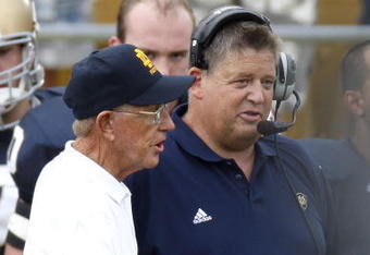 SOUTH BEND, IN - SEPTEMBER 13: Former head coach Lou Holtz of the Notre Dame Fighting Irish talks to current head coach Charlie Weis prior to playing the Michigan Wolverines on September 13, 2008 at Notre Dame Stadium in South Bend, Indiana.  (Photo by Gregory Shamus/Getty Images)