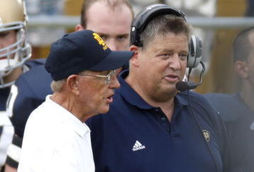 SOUTH BEND, IN - SEPTEMBER 13: Former head coach Lou Holtz of the Notre Dame Fighting Irish talks to current head coach Charlie Weis prior to playing the Michigan Wolverines on September 13, 2008 at Notre Dame Stadium in South Bend, Indiana.  (Photo by Gregory Shamus/Getty Images)