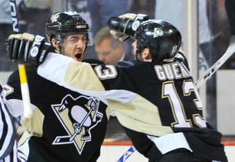 PITTSBURGH - MAY 06:  Kris Letang #58 and Bill Guerin #13 of the Pittsburgh Penguins celebrate Letang's overtime goal against the Washington Capitals during Game Three of the Eastern Conference Semifinal Round of the 2009 Stanley Cup Playoffs at Mellon Arena on May 6, 2009 in Pittsburgh, Pennsylvania. The Penguins defeated the Capitals 3-2.  (Photo by Jamie Sabau/Getty Images)