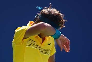 NEW YORK - SEPTEMBER 13:  Rafael Nadal of Spain wipes his brow during the Men�s Singles Semifinal match against Juan Martin Del Potro of Argentina on day fourteen of the 2009 U.S. Open at the USTA Billie Jean King National Tennis Center on September 13, 2009 in the Flushing neighborhood of the Queens borough of New York City.  Del Potro defeated Nadal 6-2, 6-2, 6-2. (Photo by Clive Brunskill/Getty Images)
