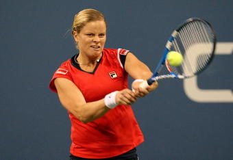 NEW YORK - SEPTEMBER 12:  Kim Clijsters of Belgium returns a shot to Serena Williams during the Women's Singles Semifinal match on day thirteen of the 2009 U.S. Open at the USTA Billie Jean King National Tennis Center on September 12, 2009 in the Flushing neighborhood of the Queens borough of New York City.  (Photo by Jim McIsaac/Getty Images)