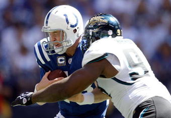 INDIANAPOLIS - SEPTEMBER 13:  Peyton Manning #18 of the Indianapolis Colts is sacked by Reggie Hayward #97 of the Jacksonville Jaguars during the game at Lucas Oil Stadium on September 13, 2009 in Indianapolis, Indiana.  (Photo by Andy Lyons/Getty Images)