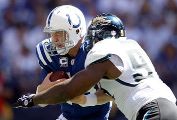 INDIANAPOLIS - SEPTEMBER 13:  Peyton Manning #18 of the Indianapolis Colts is sacked by Reggie Hayward #97 of the Jacksonville Jaguars during the game at Lucas Oil Stadium on September 13, 2009 in Indianapolis, Indiana.  (Photo by Andy Lyons/Getty Images)