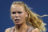 NEW YORK - SEPTEMBER 09:  Caroline Wozniacki of Denmark reacts to a point against Melanie Oudin of the United States during day ten of the 2009 U.S. Open at the USTA Billie Jean King National Tennis Center on September 9, 2009 in the Flushing neighborhood of the Queens borough of New York City.  (Photo by Nick Laham/Getty Images)