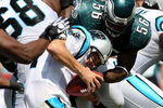 CHARLOTTE, NC - SEPTEMBER 13:  Quarterback Jake Delhomme #17 of the Carolina Panthers is sacked by Linebacker Jordan Akeem #56, of the Philadelphia Eagles in the first half of the NFL season opener at Bank of America Stadium on September 13, 2009 in Charlotte, North Carolina.  (Photo by Streeter Lecka/Getty Images)