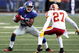 EAST RUTHERFORD, NJ - SEPTEMBER 13:  Mario Manningham #82 of the New York Giants eludes a tackle attempt from Fred Smoot #27 of the Washington Redskins enroute to a touchdown on September 13, 2009 at Giants Stadium in East Rutherford, New Jersey.  (Photo by Jim McIsaac/Getty Images)