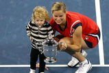 NEW YORK - SEPTEMBER 13:  Kim Clijsters of Belgium and daughter Jada pose with the championship trophy after Clijsters defeated Caroline Wozniacki of Denmark in the Women�s Singles final on day fourteen of the 2009 U.S. Open at the USTA Billie Jean King National Tennis Center on September 13, 2009 in the Flushing neighborhood of the Queens borough of New York City. Clijsters defeated Wozniacki 7-5, 6-3.  (Photo by Al Bello/Getty Images)