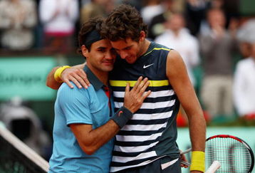 PARIS - JUNE 05:  Roger Federer (L) of Switzerland  is congratulated by Juan Martin Del Potro of Argentina following his victory during the Men's Singles Semi Final matchon day thirteen of the French Open at Roland Garros on June 5, 2009 in Paris, France.  (Photo by Clive Brunskill/Getty Images)