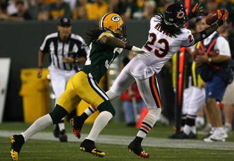 GREEN BAY, WI - SEPTEMBER 13: Devin Hester #23 of the Chicago Bears reaches out to catch a pass in front of Al Harris #31 of the Green Bay Packers on September 13, 2009 at Lambeau Field in Green Bay, Wisconsin. (Photo by Jonathan Daniel/Getty Images)