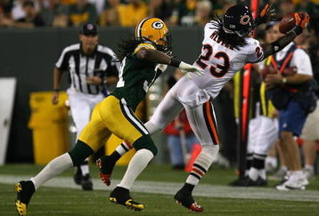GREEN BAY, WI - SEPTEMBER 13: Devin Hester #23 of the Chicago Bears reaches out to catch a pass in front of Al Harris #31 of the Green Bay Packers on September 13, 2009 at Lambeau Field in Green Bay, Wisconsin. (Photo by Jonathan Daniel/Getty Images)