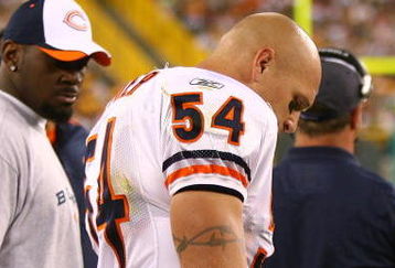 GREEN BAY, WI - SEPTEMBER 13: Brian Urlacher #54 of the Chicago Bears stands on the sidelines after being injured near the end of the first half against the Green Bay Packers on September 13, 2009 at Lambeau Field in Green Bay, Wisconsin. The Packers defeated the Bears 21-15. (Photo by Jonathan Daniel/Getty Images)