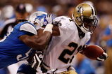 NEW ORLEANS - SEPTEMBER 13:  Mike Bell #21 of the New Orleans Saints is pushed out of bounds by Larry Foote #55 of the Detroit Lions at the Louisiana Superdome on September 13, 2009 in New Orleans, Louisiana.  (Photo by Chris Graythen/Getty Images)