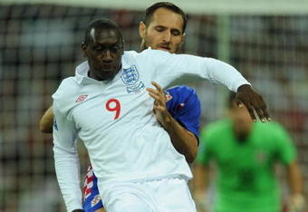 LONDON - SEPTEMBER 09:  Josip Simunic of Croatia tangles with Emile Heskey of England during the FIFA 2010 World Cup Group 6 Qualifying match between England and Croatia at Wembley Stadium on September 9, 2009 in London, England. (Photo by Shaun Botterill/Getty Images)