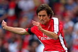 LONDON, ENGLAND - AUGUST 01:  Tomas Rosicky of Arsenal passes the balll during the Emirates Cup match between Arsenal and Athletico Madrid at the Emirates Stadium on August 1, 2009 in London, England.  (Photo by Phil Cole/Getty Images)