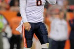 DENVER - AUGUST 30:  Quarterback Jay Cutler #6 of the Chicago Bears heads for the sidelines as he runs the offense against the Denver Broncos during preseason NFL action at INVESCO Field at Mile High on August 30, 2009 in Denver, Colorado. The Bears defeated the Broncos 27-17.  (Photo by Doug Pensinger/Getty Images)