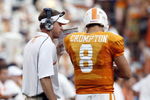 KNOXVILLE, TN - SEPTEMBER 12: Lane Kiffin, head coach of  the Tennessee Volunteers talks with Jonathan Crompton #8 of the Tennessee Volunteers during a timeout against the UCLA Bruins on September 12, 2009 at Neyland Stadium in Knoxville, Tennessee. The Bruins beat the Volunteers 19-15. (Photo by Joe Murphy/Getty Images)