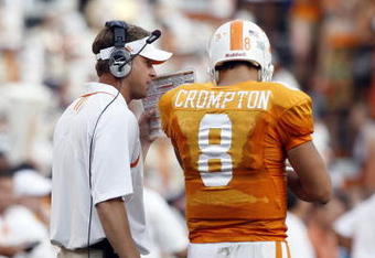 KNOXVILLE, TN - SEPTEMBER 12: Lane Kiffin, head coach of  the Tennessee Volunteers talks with Jonathan Crompton #8 of the Tennessee Volunteers during a timeout against the UCLA Bruins on September 12, 2009 at Neyland Stadium in Knoxville, Tennessee. The Bruins beat the Volunteers 19-15. (Photo by Joe Murphy/Getty Images)