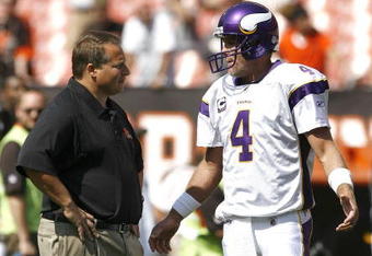 CLEVELAND - SEPTEMBER 13:  Brett Farve #4 of the Minnesota Vikings hugs Eric Mangini head coach of the Cleveland Browns talk prior to the game against the Cleveland Browns at Cleveland Browns Stadium on September 13, 2009 in Cleveland, Ohio.  (Photo by Matt Sullivan/Getty Images)