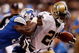 NEW ORLEANS - SEPTEMBER 13:  Mike Bell #21 of the New Orleans Saints is pushed out of bounds by Larry Foote #55 of the Detroit Lions at the Louisiana Superdome on September 13, 2009 in New Orleans, Louisiana.  (Photo by Chris Graythen/Getty Images)