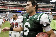 HOUSTON - SEPTEMBER 13: Quarterback Mark Sanchez #6 of the New York Jets leaves the field with the game ball after defeating the Houston Texans 24-7 at Reliant Stadium on September 13, 2009 in Houston, Texas. (Photo by Bob Levey/Getty Images)