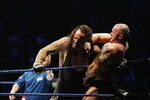 SYDNEY, AUSTRALIA - JUNE 15:  The Undertaker (L) pushes Bam Neely into the corner during WWE Smackdown at Acer Arena on June 15, 2008 in Sydney, Australia.  (Photo by Gaye Gerard/Getty Images)
