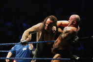 SYDNEY, AUSTRALIA - JUNE 15: The Undertaker (L) pushes Bam Neely into the corner during WWE Smackdown at Acer Arena on June 15, 2008 in Sydney, Australia. (Photo by Gaye Gerard/Getty Images)