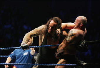 SYDNEY, AUSTRALIA - JUNE 15:  The Undertaker (L) pushes Bam Neely into the corner during WWE Smackdown at Acer Arena on June 15, 2008 in Sydney, Australia.  (Photo by Gaye Gerard/Getty Images)