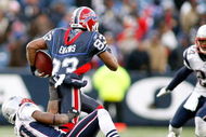 ORCHARD PARK, NY - DECEMBER 28: Ellis Hobbs III #27 of the New England Patriots pulls down Lee Evans #83 of the Buffalo Bills at Ralph Wilson Stadium December 28, 2008 in Orchard Park, New York. The Patriots won 13-0. (Photo by Rick Stewart/Getty Images)