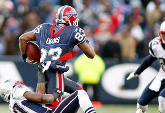 ORCHARD PARK, NY - DECEMBER 28: Ellis Hobbs III #27 of the New England Patriots pulls down Lee Evans #83 of the Buffalo Bills at Ralph Wilson Stadium December 28, 2008 in Orchard Park, New York. The Patriots won 13-0. (Photo by Rick Stewart/Getty Images)