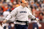 BLACKSBURG, VA - NOVEMBER 27:  Coach Al Groh of the Virginia Cavaliers questions a penalty call during a 24-10 loss to the Virginia Tech Hokies during a game on November 27, 2004, at Lane Stadium in Blacksburg, Virginia. (Photo By Grant Halverson/Getty Images)