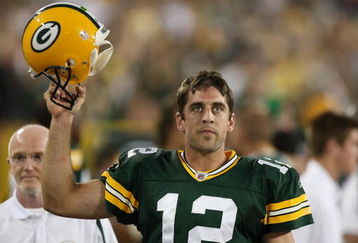 GREEN BAY, WI - SEPTEMBER 13: Aaron Rodgers #12 of the Green Bay Packers celebrates throwing the winning touchdown pass against the Chicago Bears on September 13, 2009 at Lambeau Field in Green Bay, Wisconsin. The Packers defeated the Bears 21-15. (Photo by Jonathan Daniel/Getty Images)