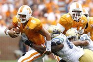 KNOXVILLE, TN - SEPTEMBER 12: David Carter #85 of the UCLA Bruins sacks Jonathan Crompton #8 of the Tennessee Volunteers on September 12, 2009 at Neyland Stadium in Knoxville, Tennessee. (Photo by Joe Murphy/Getty Images)