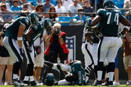 CHARLOTTE, NC - SEPTEMBER 13:  Quarterback Donovan McNabb #5 of the Philadelphia Eagles lays on the ground after injuring his knee in the second half of their NFL season opener against the Carolina Panthers at Bank of America Stadium on September 13, 2009 in Charlotte, North Carolina. McNabb did not return to the game. (Photo by Streeter Lecka/Getty Images)