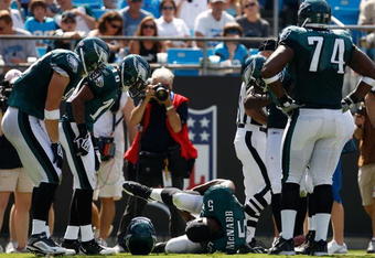 CHARLOTTE, NC - SEPTEMBER 13:  Quarterback Donovan McNabb #5 of the Philadelphia Eagles lays on the ground after injuring his knee in the second half of their NFL season opener against the Carolina Panthers at Bank of America Stadium on September 13, 2009 in Charlotte, North Carolina. McNabb did not return to the game. (Photo by Streeter Lecka/Getty Images)
