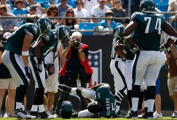 CHARLOTTE, NC - SEPTEMBER 13:  Quarterback Donovan McNabb #5 of the Philadelphia Eagles lays on the ground after injuring his knee in the second half of their NFL season opener against the Carolina Panthers at Bank of America Stadium on September 13, 2009 in Charlotte, North Carolina. McNabb did not return to the game. (Photo by Streeter Lecka/Getty Images)