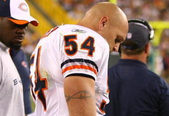 GREEN BAY, WI - SEPTEMBER 13: Brian Urlacher #54 of the Chicago Bears stands on the sidelines after being injured near the end of the first half against the Green Bay Packers on September 13, 2009 at Lambeau Field in Green Bay, Wisconsin. The Packers defeated the Bears 21-15. (Photo by Jonathan Daniel/Getty Images)