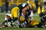 GREEN BAY, WI - SEPTEMBER 13: Cullen Jenkins #77 and Aaron Kampman #74 of the Green Bay Packers sack Jay Cutler #6 of the Chicago Bears on September 13, 2009 at Lambeau Field in Green Bay, Wisconsin. The Packers defeated the Bears 21-15. (Photo by Jonathan Daniel/Getty Images)