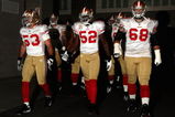 GLENDALE, AZ - SEPTEMBER 13:  (L-R) Jeff Ulbrich #53, Patrick Willis #52 and Adam Snyder #68 of the San Francisco 49ers walk out onto the field prior to the NFL game against the Arizona Cardinals at the Universtity of Phoenix Stadium on September 13, 2009 in Glendale, Arizona.  (Photo by Christian Petersen/Getty Images)