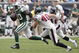 HOUSTON - SEPTEMBER 13: Running back Thomas Jones #20 of the New York Jets eludes free safety John Busing #40 of the Houston Texans as he scores on a 38 yard run in the fourth quarter at Reliant Stadium on September 13, 2009 in Houston, Texas. (Photo by Bob Levey/Getty Images)